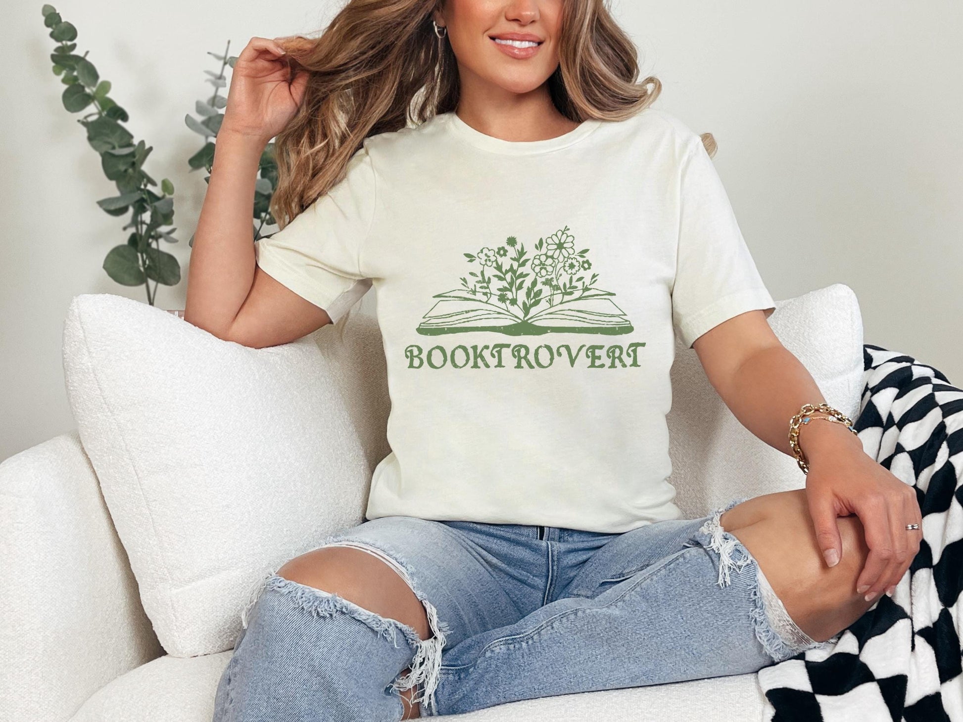 a woman sitting on a couch with her legs crossed