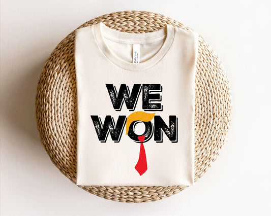 a t - shirt that says we won with a tie on it
