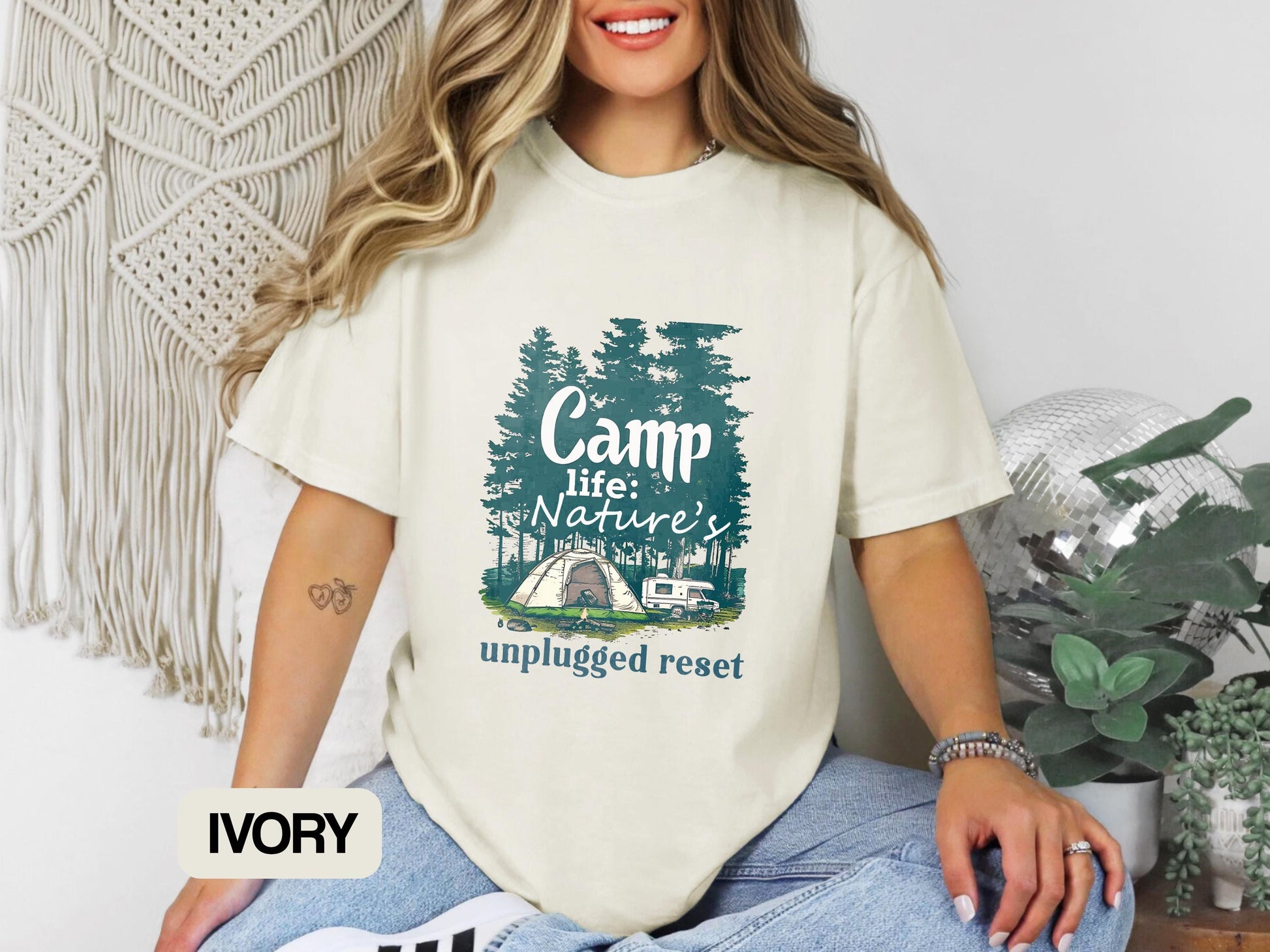 a woman wearing a t - shirt that says camp is nature unplugged