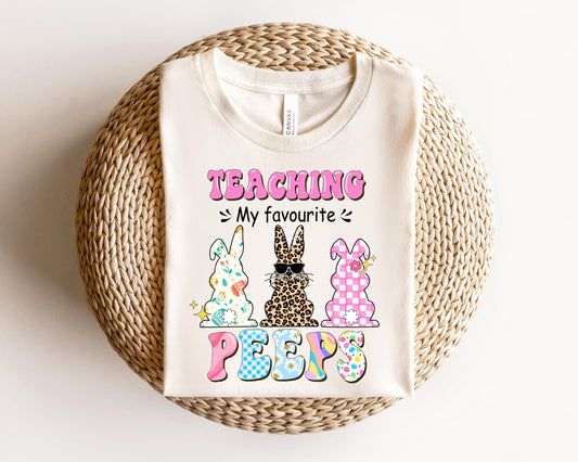 a t - shirt that says teaching is my favorite peeps