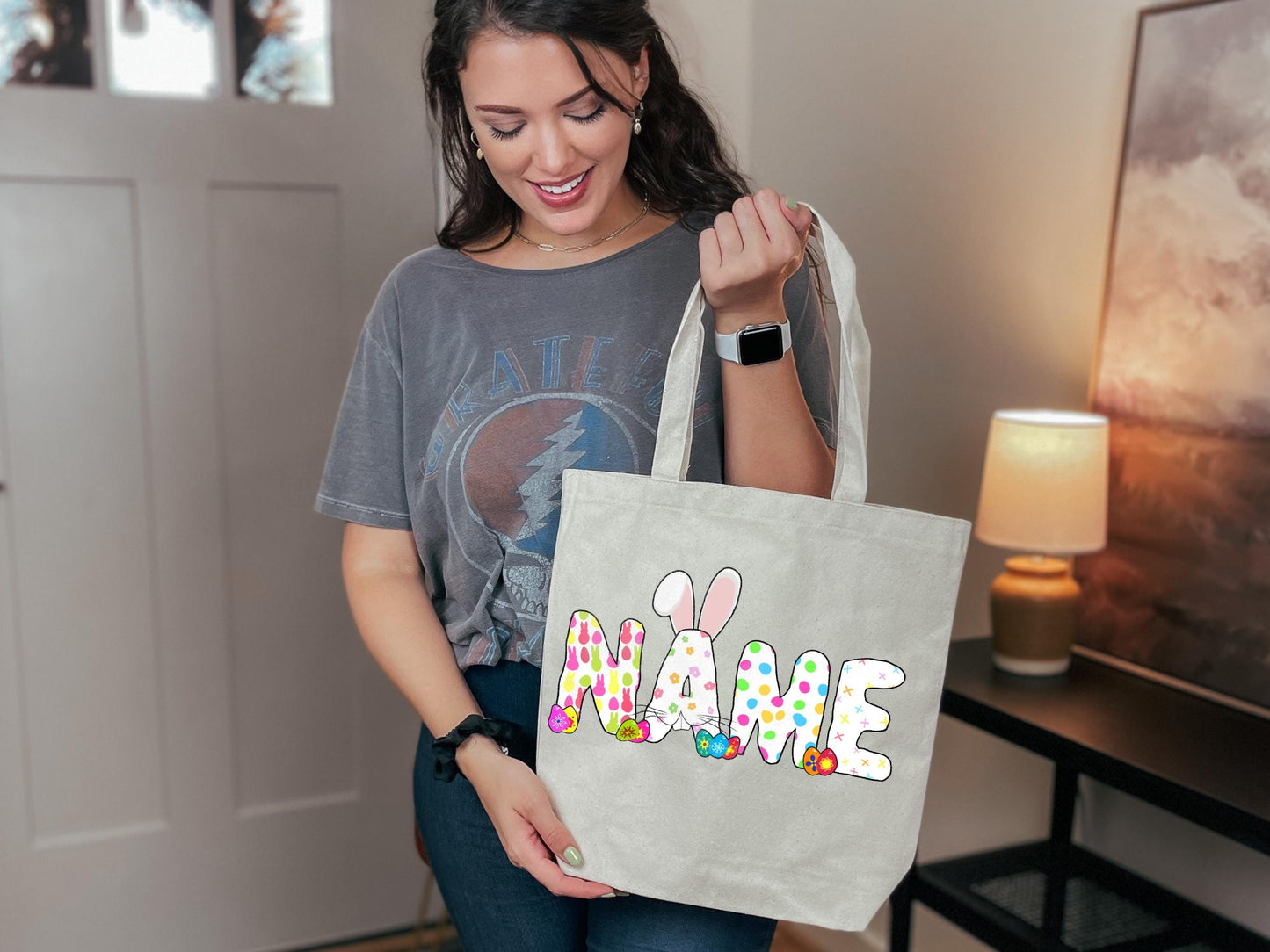 a woman holding a bag with a name on it