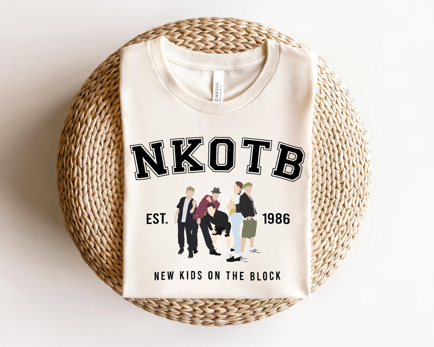 a white t - shirt with a picture of three men on it