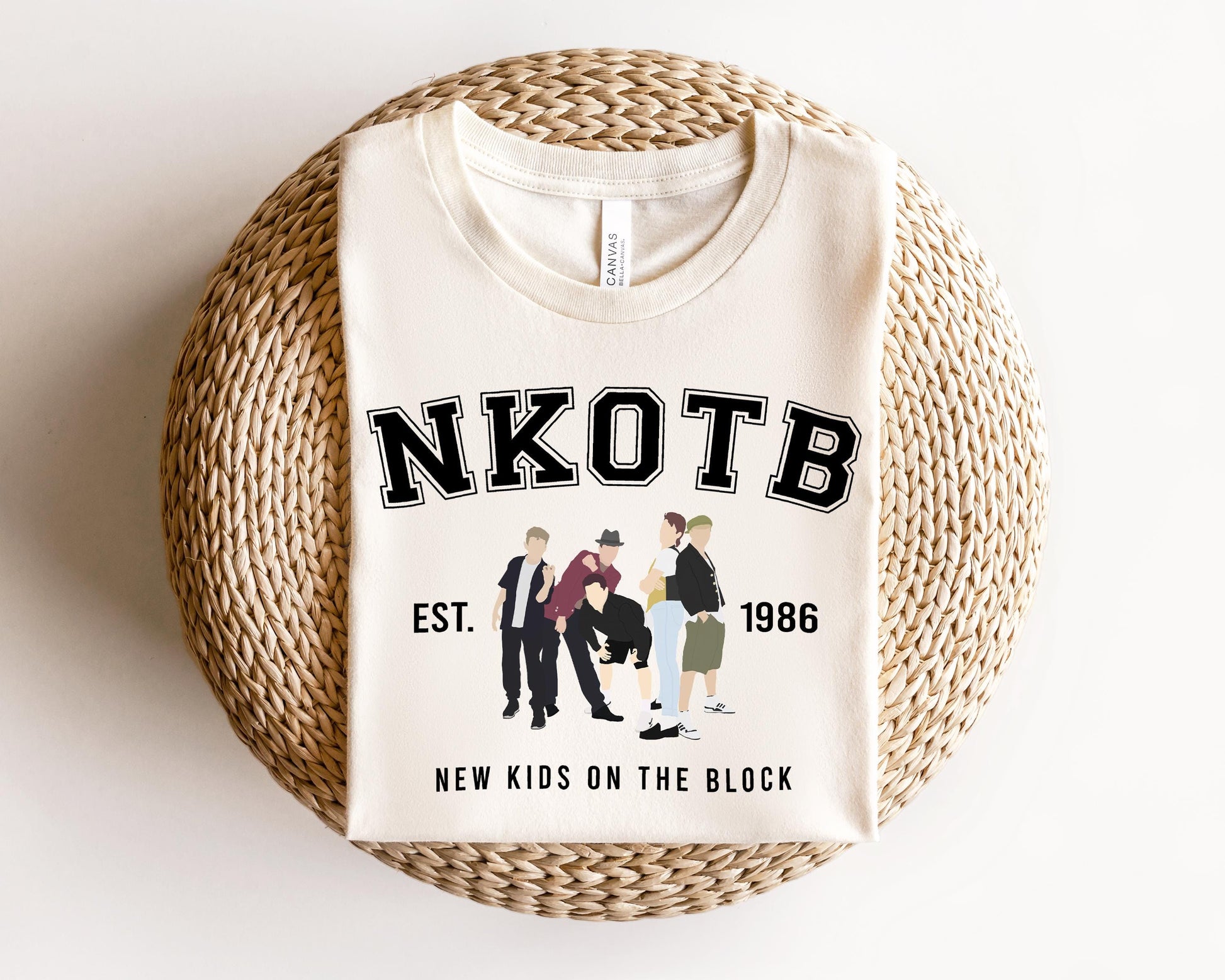 a white t - shirt with a picture of three men on it
