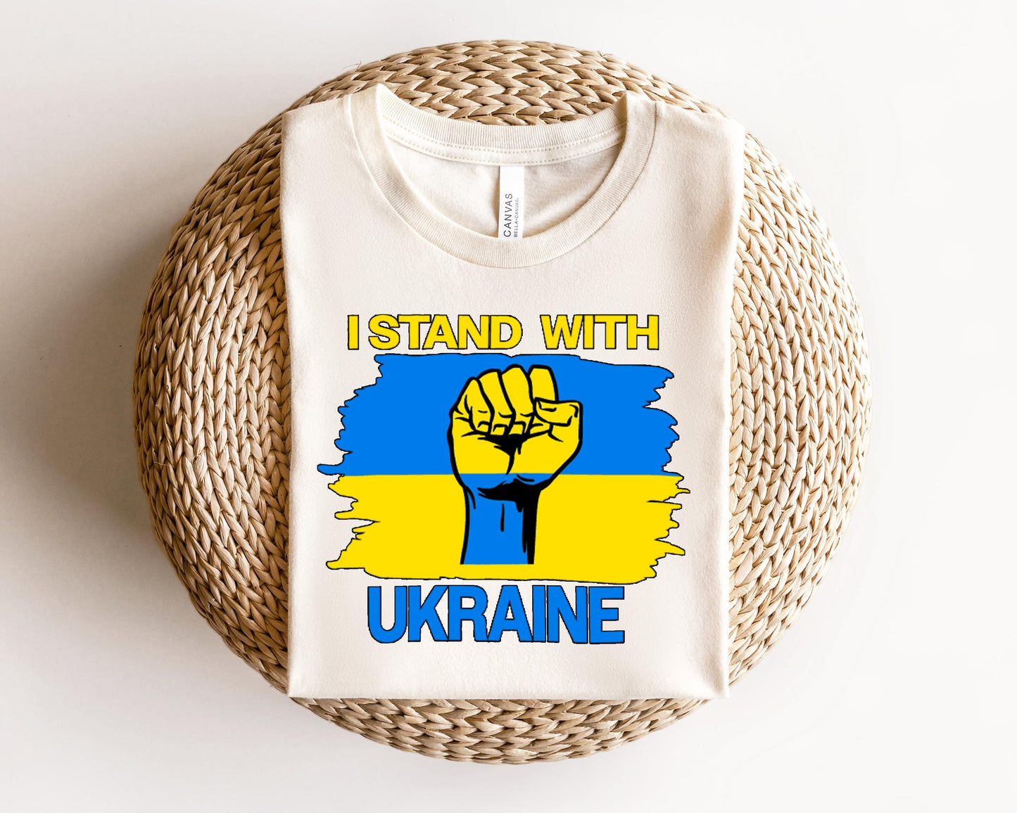 a t - shirt with a picture of a fist that says i stand with ukraine