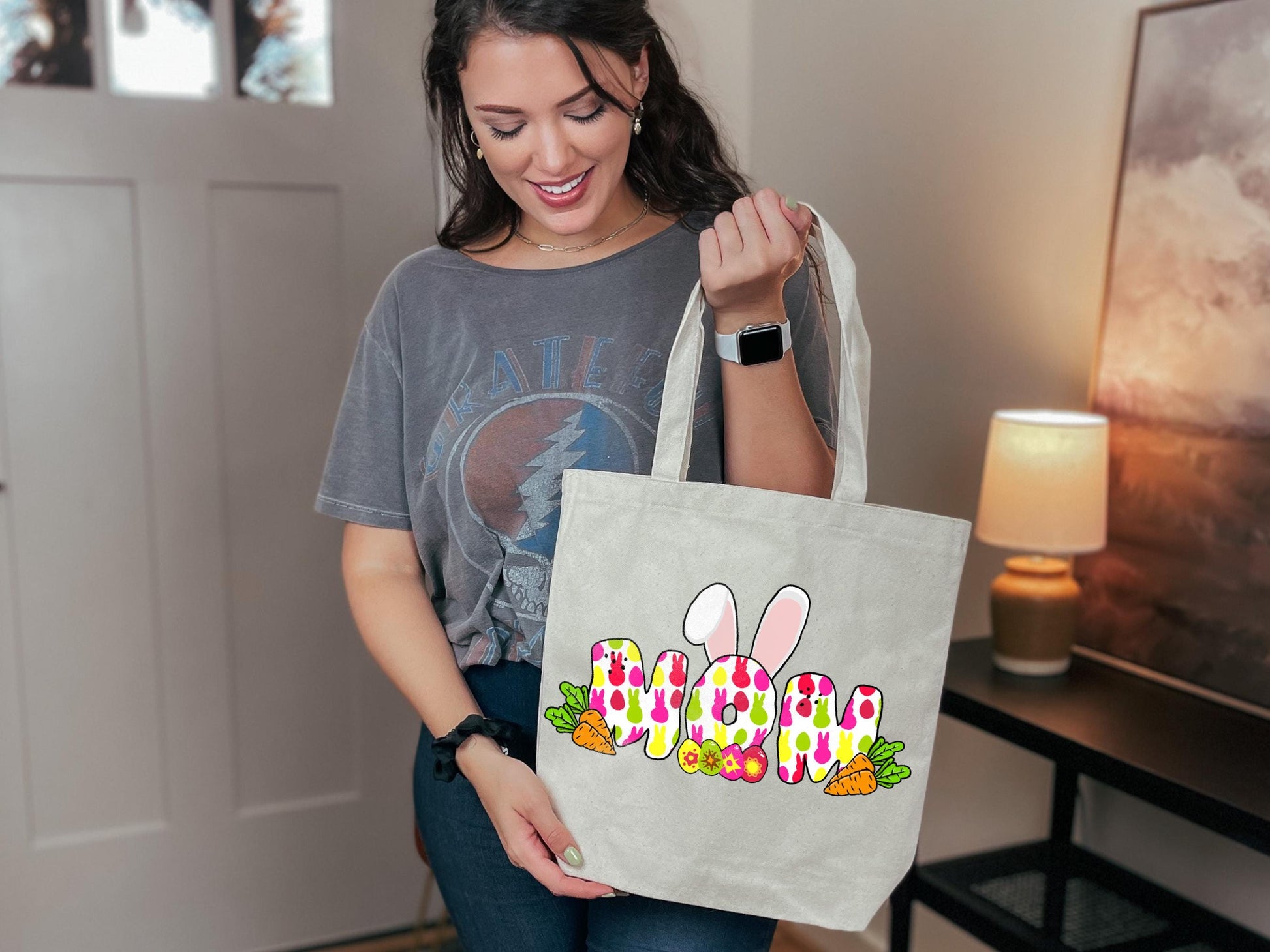 a woman holding a bag with a bunny design on it
