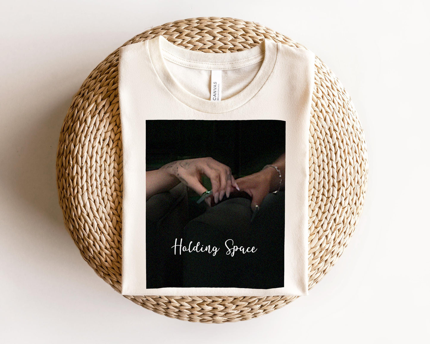 a white t - shirt with a picture of a woman&#39;s hand on it