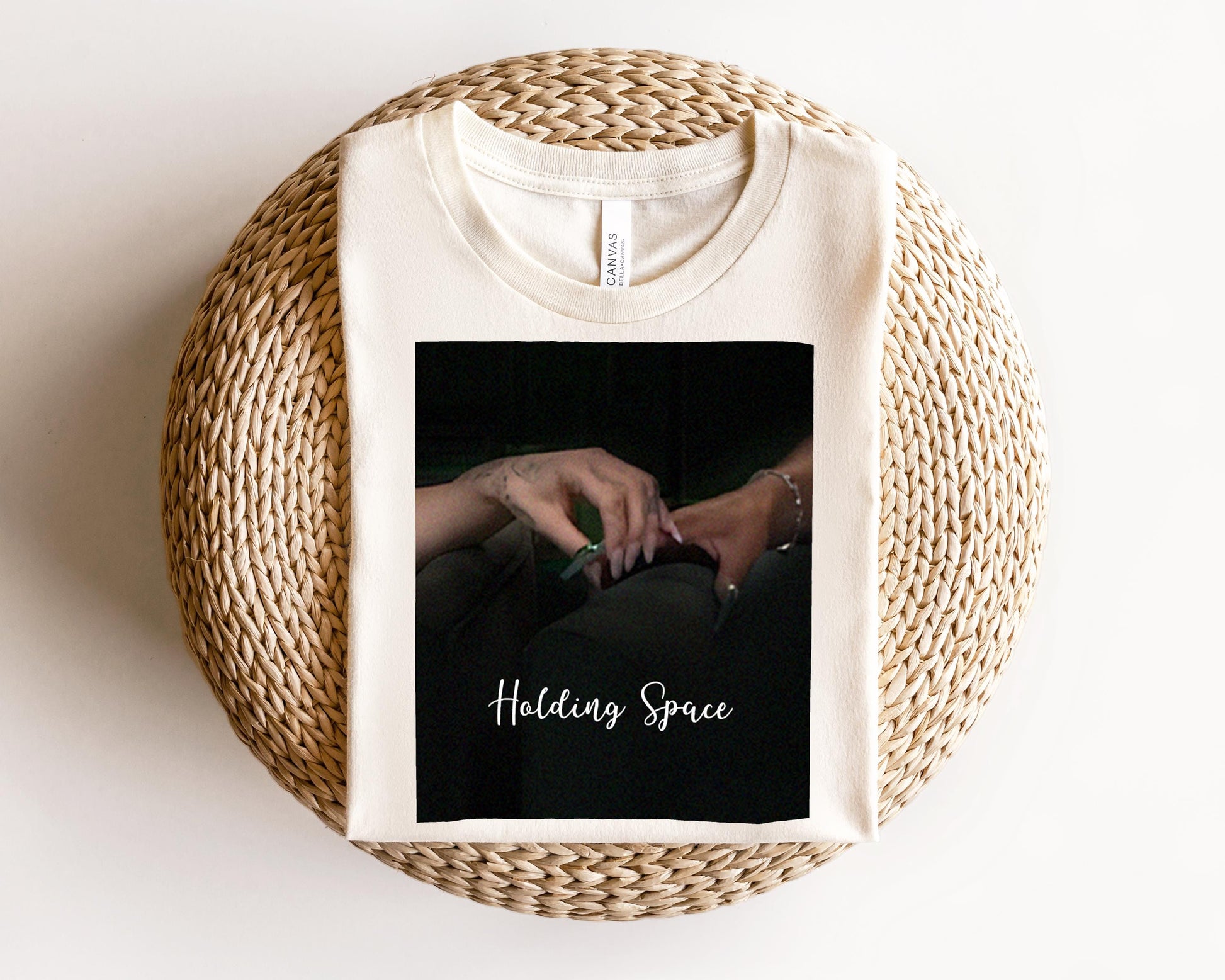 a white t - shirt with a picture of a woman&#39;s hand on it