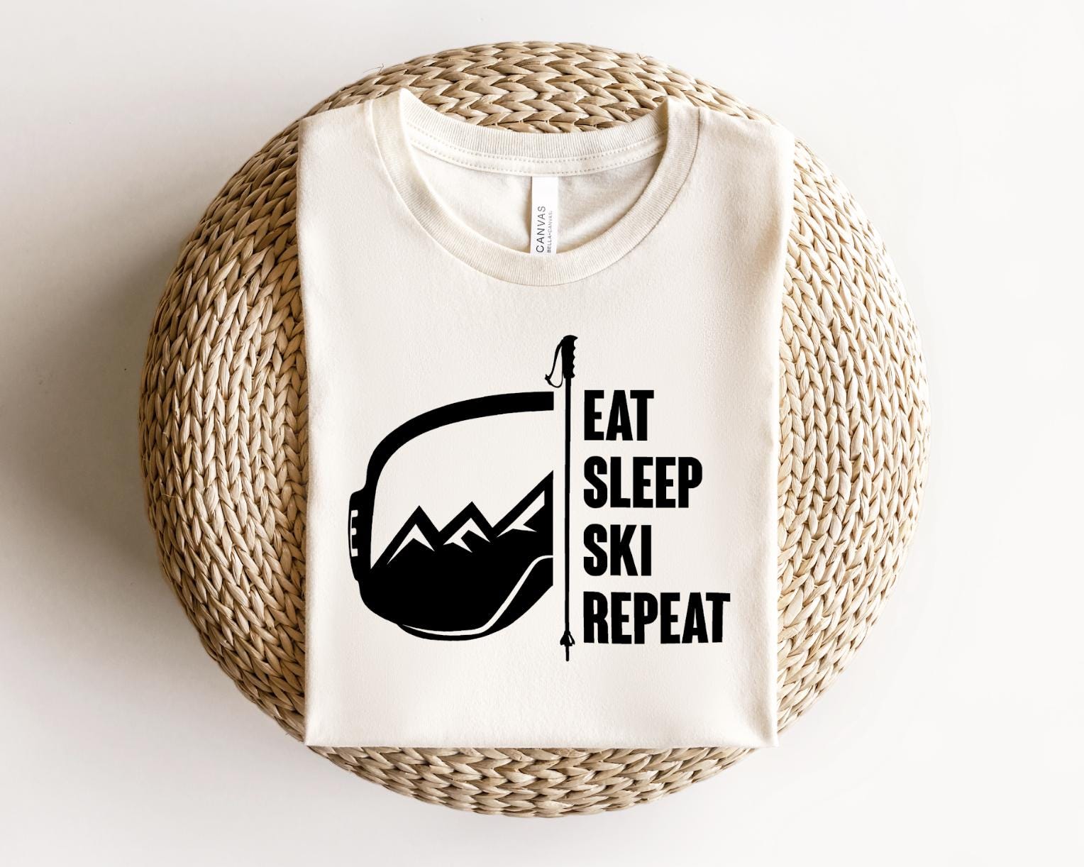 a t - shirt that says eat sleep ski repeat