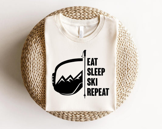 a t - shirt that says eat sleep ski repeat