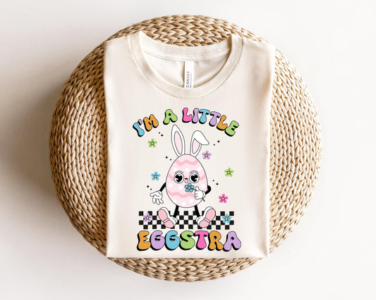 a white t - shirt with a cartoon bunny on it