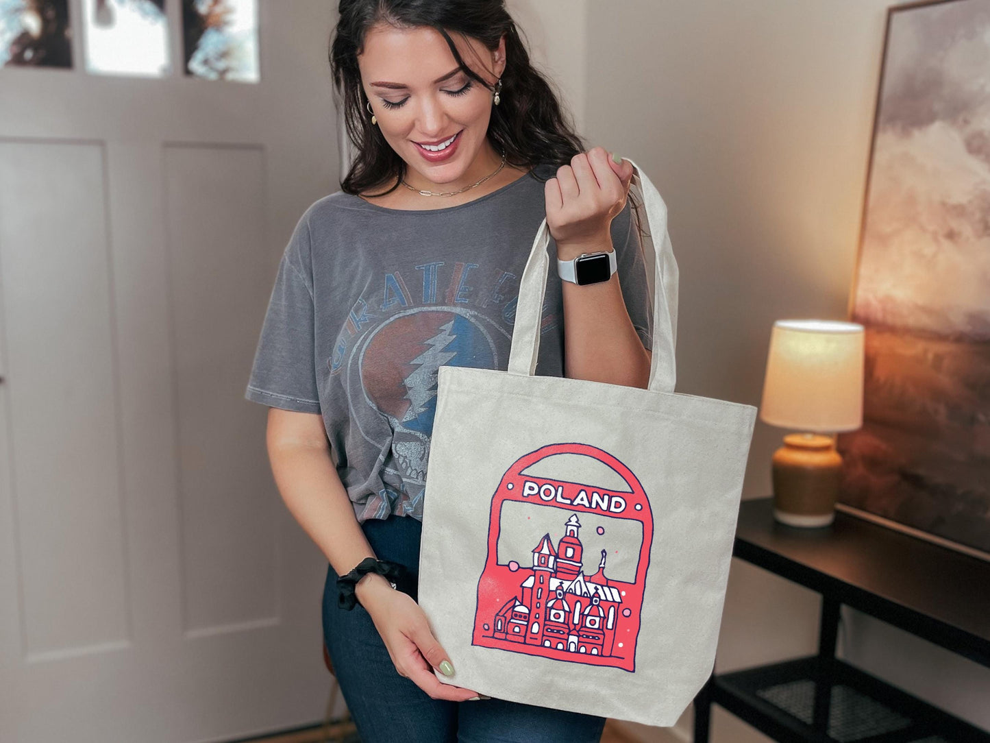 a woman holding a shopping bag in her hand