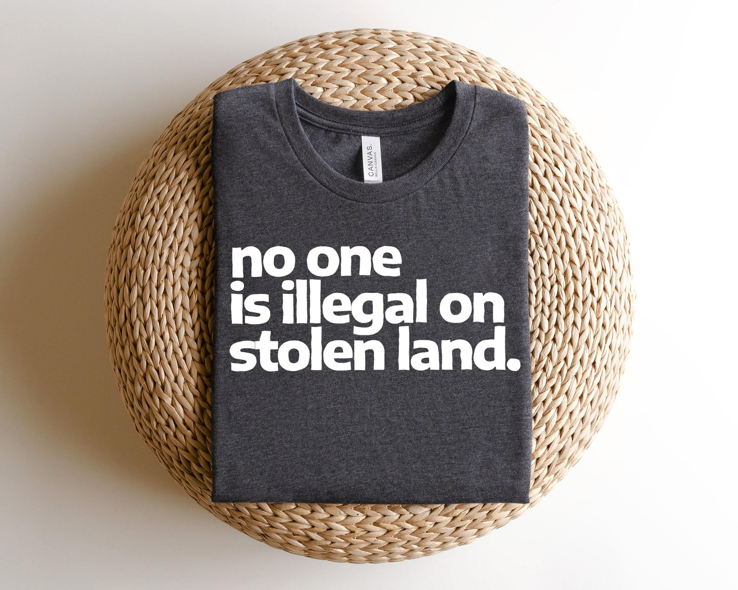a t - shirt that says no one is illegal on stolen land