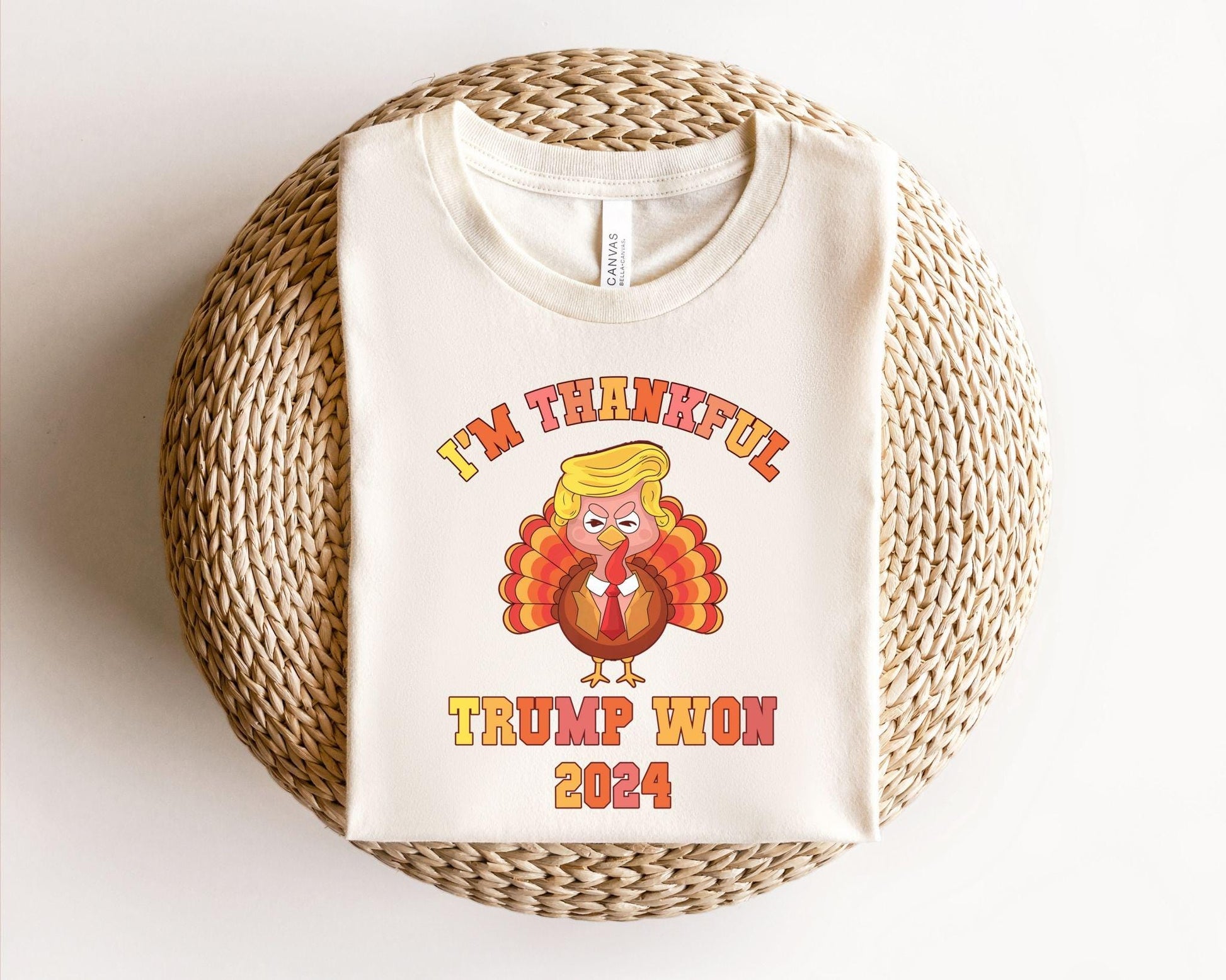 a white t - shirt with a cartoon turkey on it