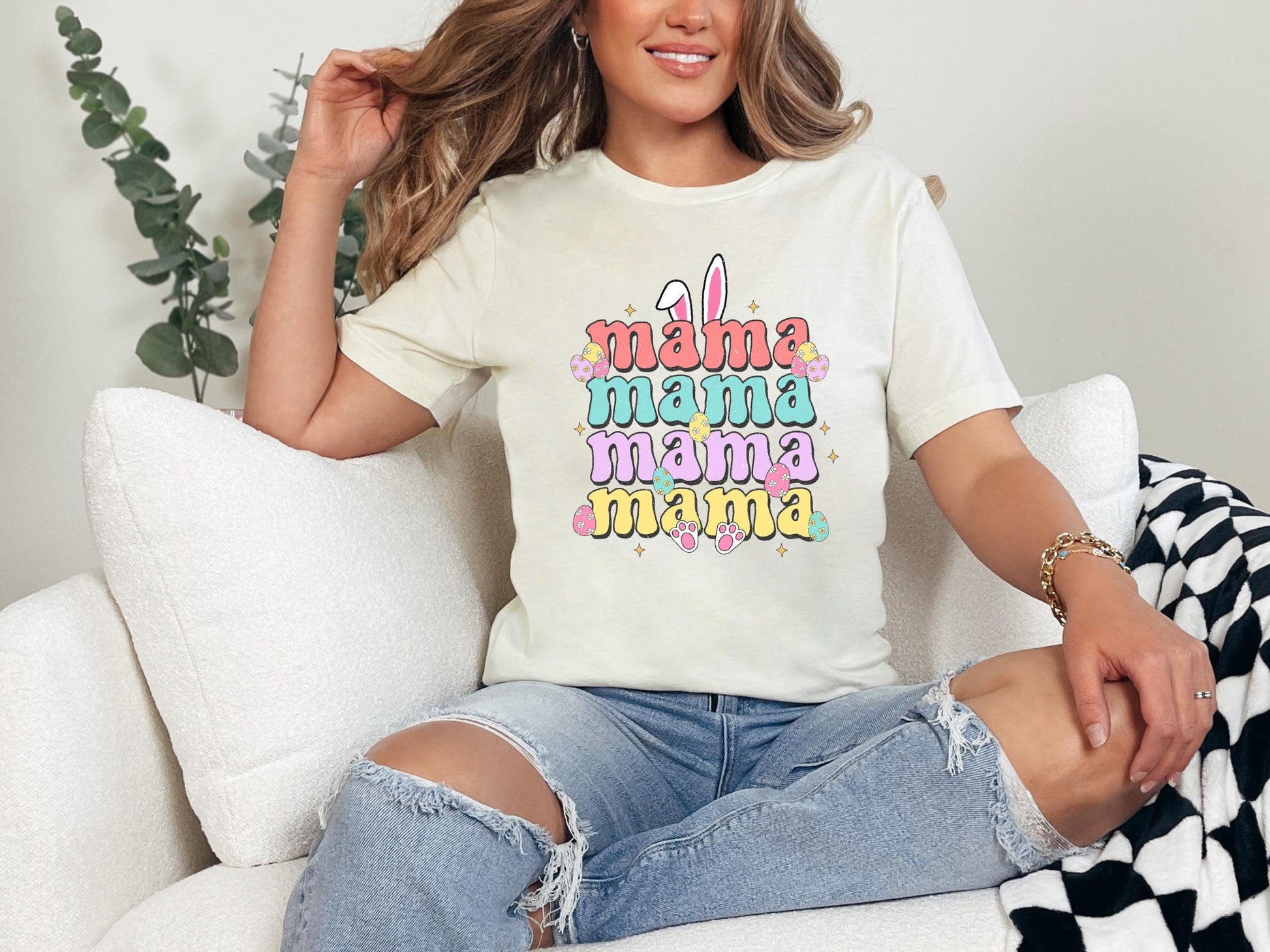 a woman sitting on a couch wearing a white shirt