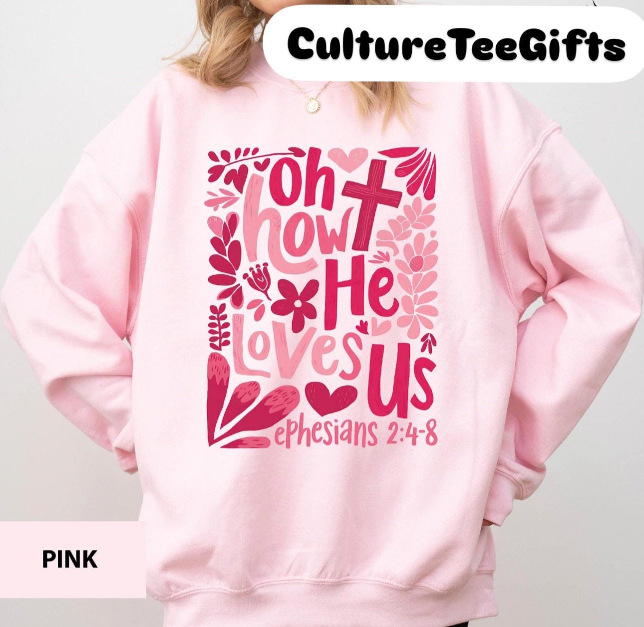a girl wearing a pink sweatshirt with a bible verse on it
