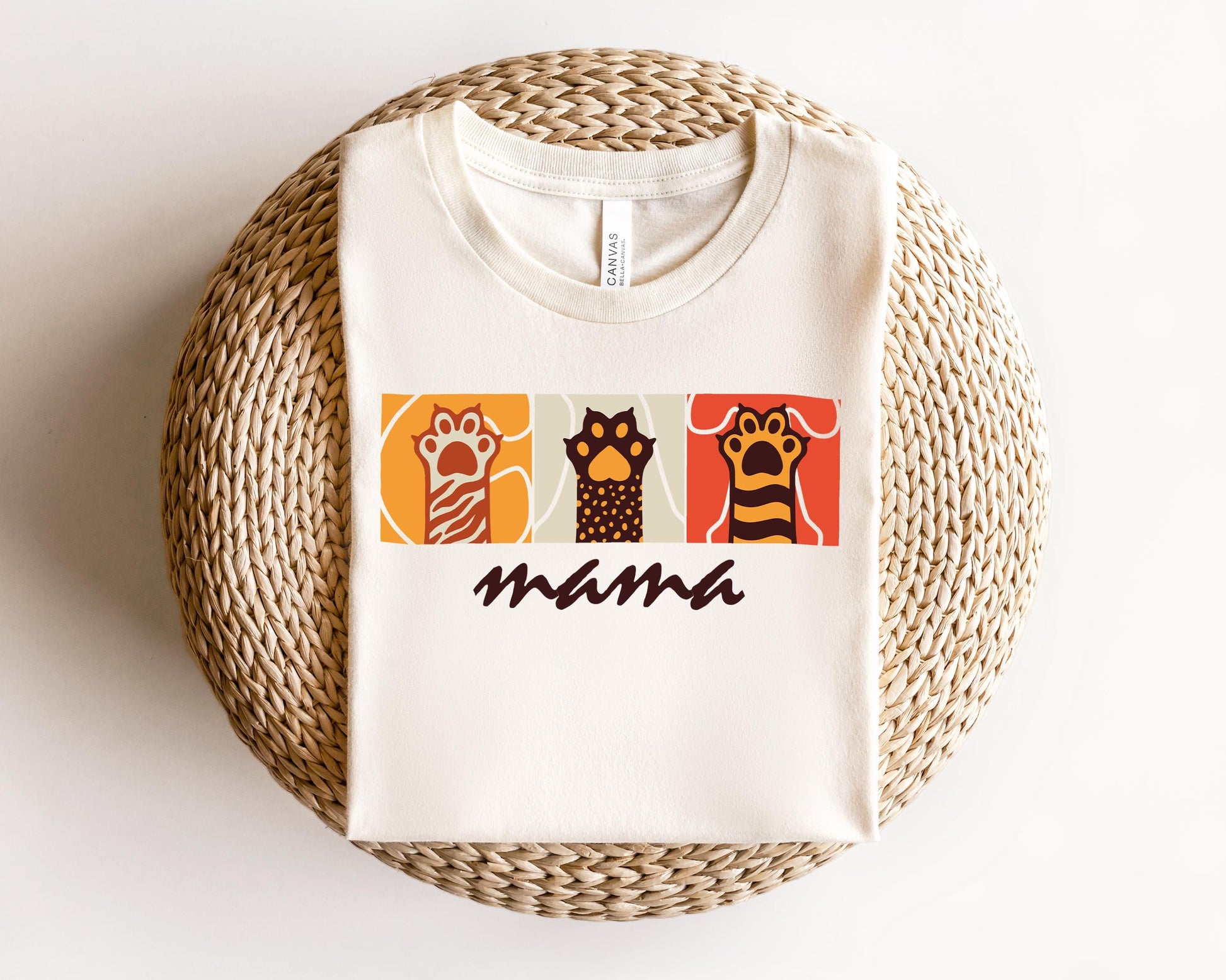a white t - shirt with an image of three owls on it
