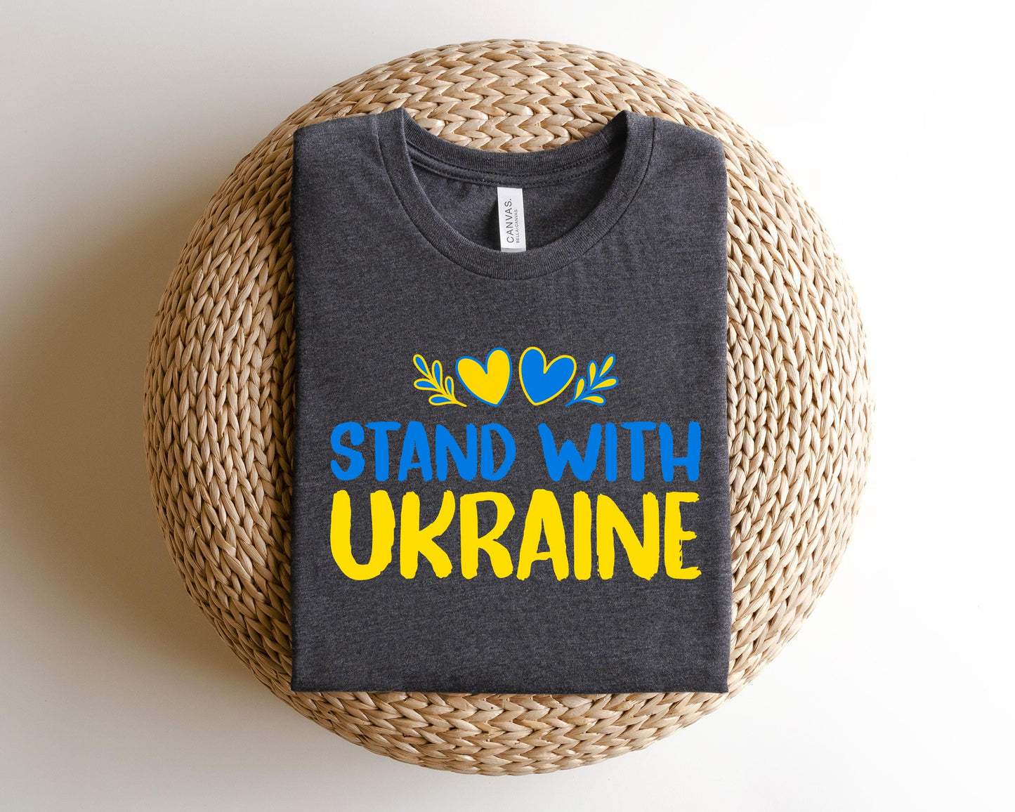 a t - shirt that says stand with ukraine on it