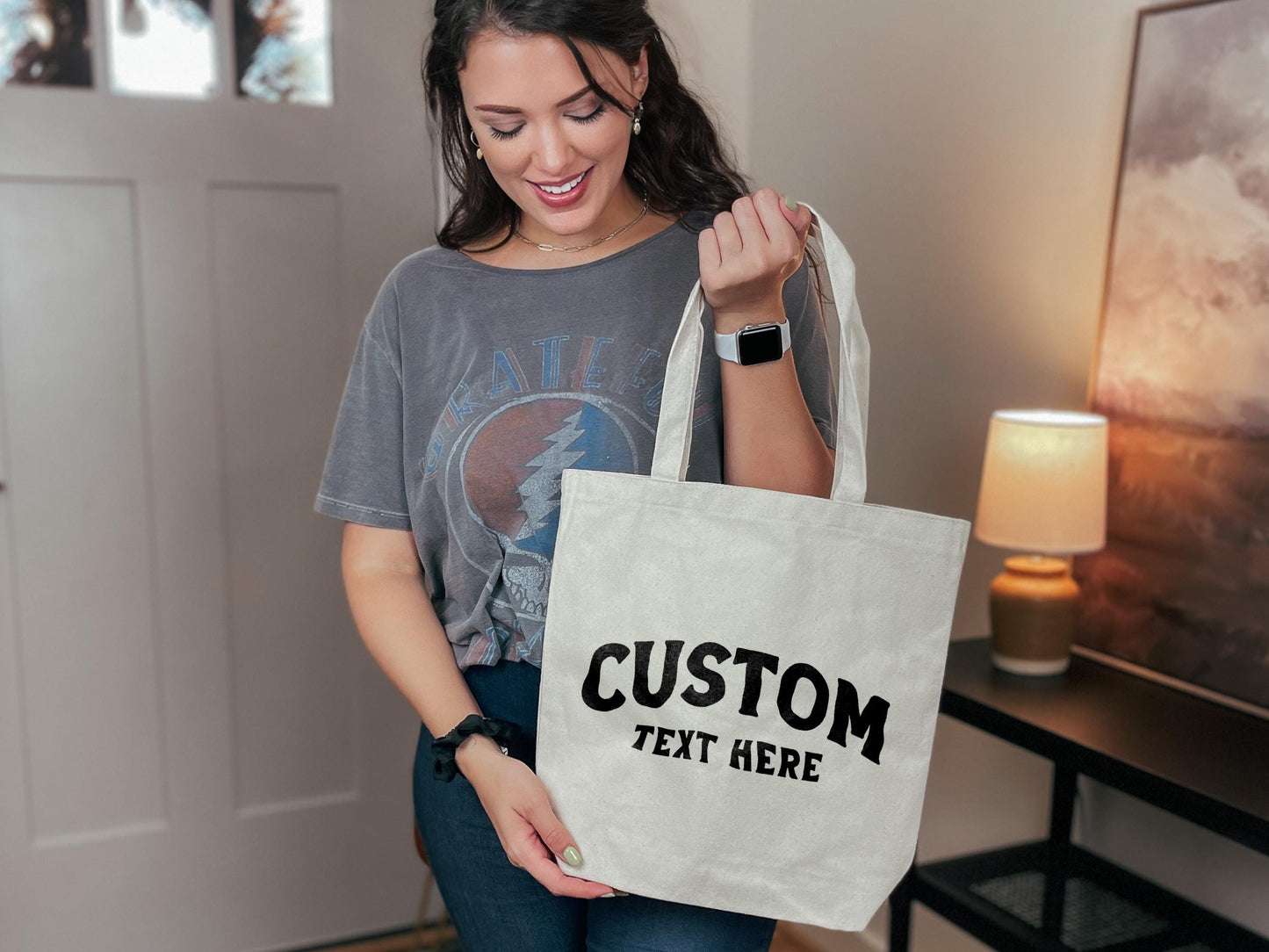 a woman holding a bag that says custom text here