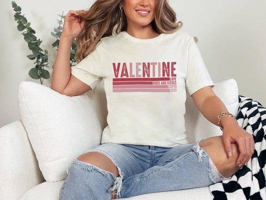 a woman sitting on a white couch wearing a valentine&#39;s t - shirt