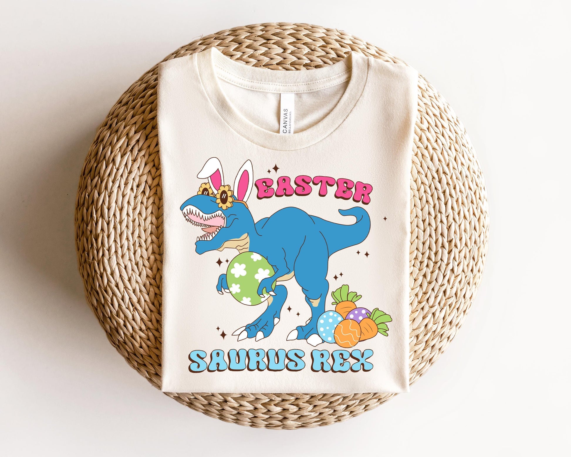 a white t - shirt with a dinosaur on it